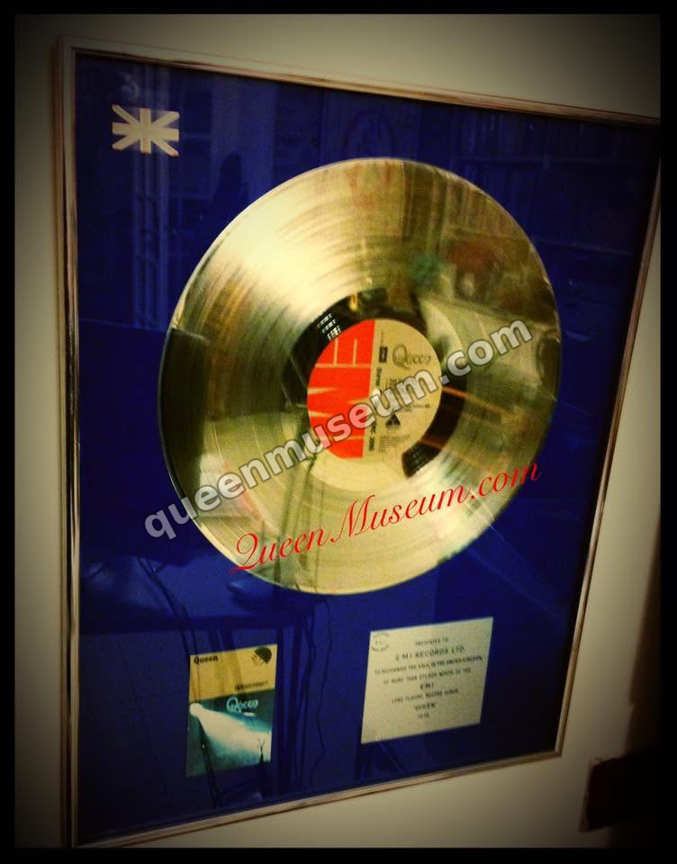 UK 1974 BPI Silver Disc for Queen, presented to EMI Records, shown alongside the debut album sleeve