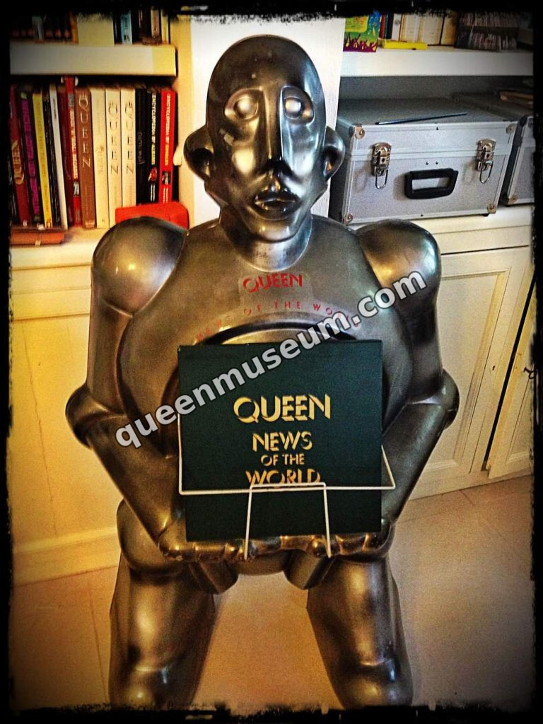 Three-dimensional promotional robot figure holding a rare UK-only News of the World promotional box